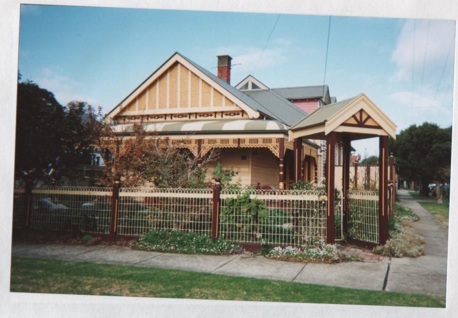 Timber-framed wire fence and gate at a weatherboard home