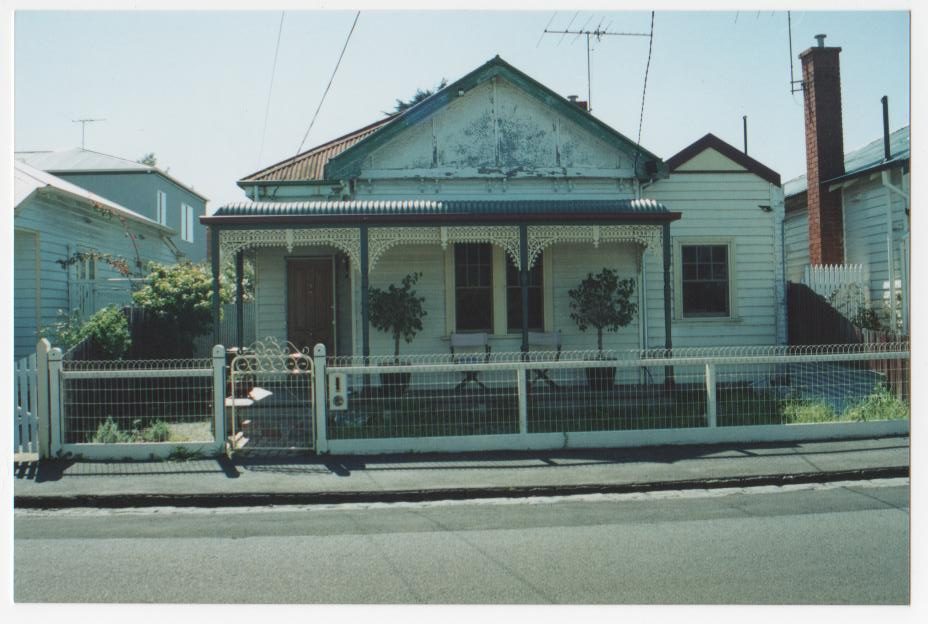 Decorative metal gate with small front garden