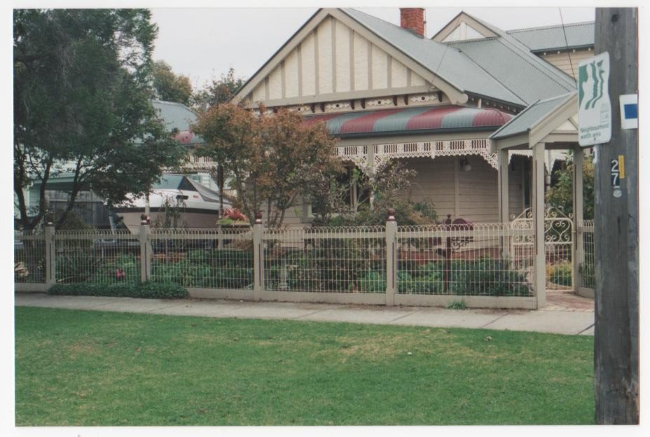 Wire fence around a gabled-roof home